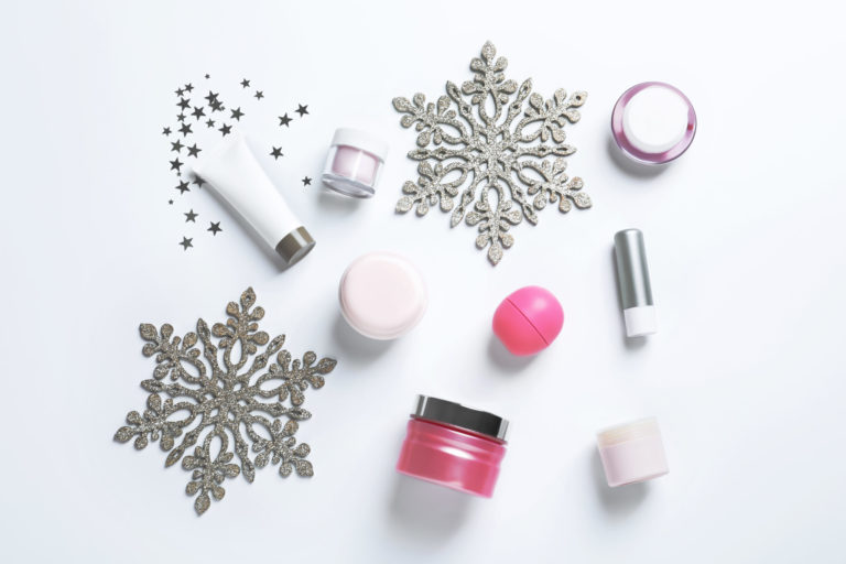 Set of cosmetic products on white background, flat lay. Winter care